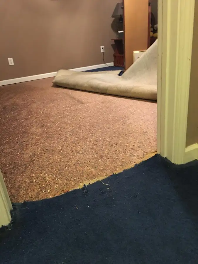 Carpet pad removal revealing water damage during Drying & Dehumidification in Deschutes River Woods